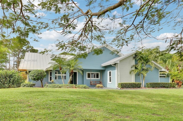 view of front of home with stucco siding and a front yard