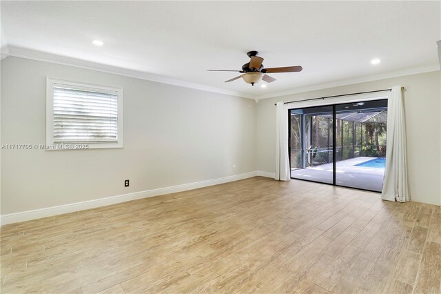 empty room with light wood-style flooring, a ceiling fan, and ornamental molding