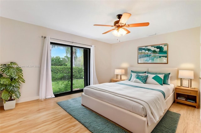 bedroom featuring visible vents, baseboards, ceiling fan, and light wood finished floors