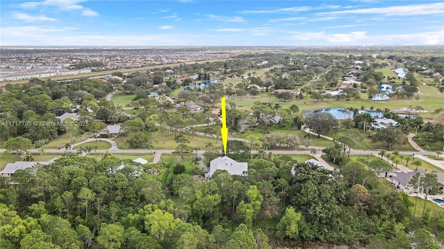 birds eye view of property featuring a water view and a residential view