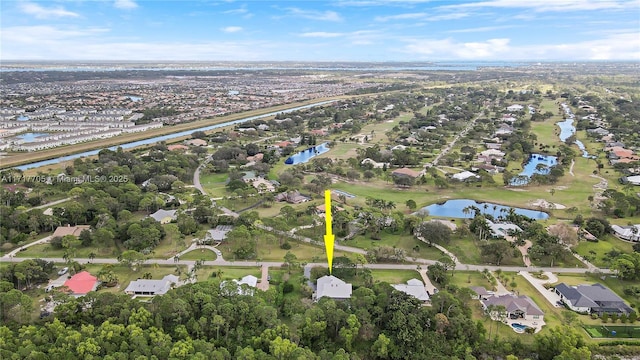 bird's eye view with a residential view and a water view