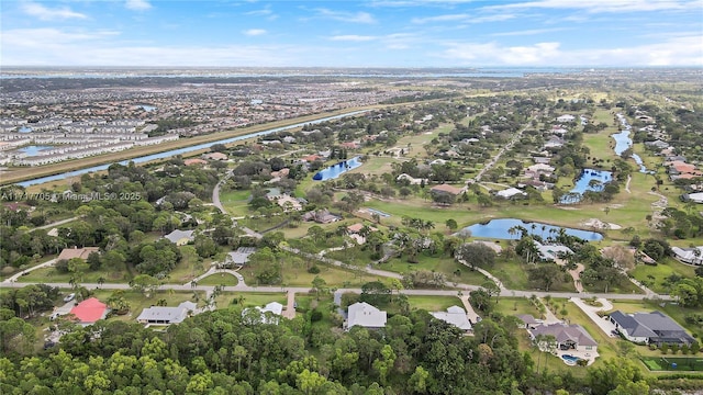 drone / aerial view with a residential view and a water view