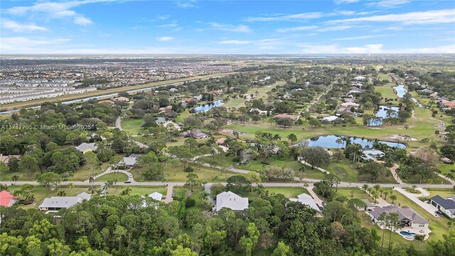 bird's eye view with a residential view and a water view