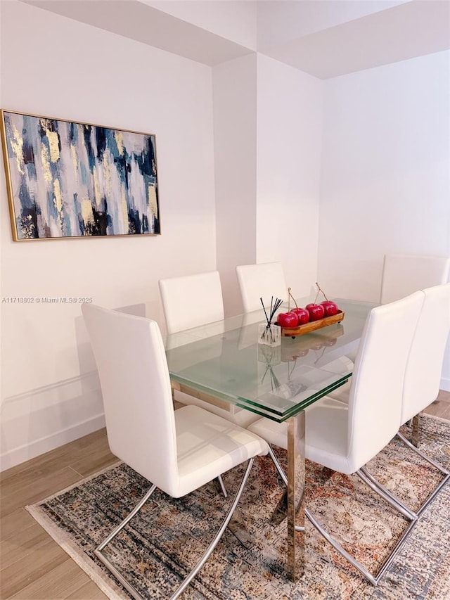 dining area featuring hardwood / wood-style floors