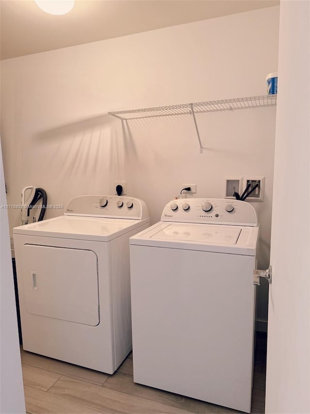 laundry room with washing machine and clothes dryer