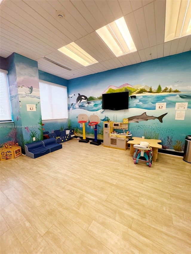 recreation room featuring light hardwood / wood-style floors