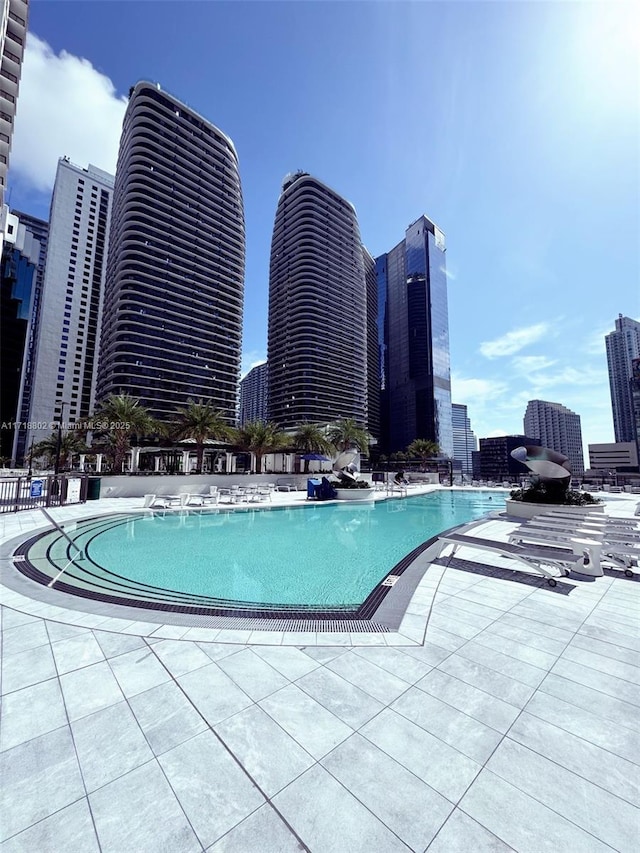 view of swimming pool with a patio area