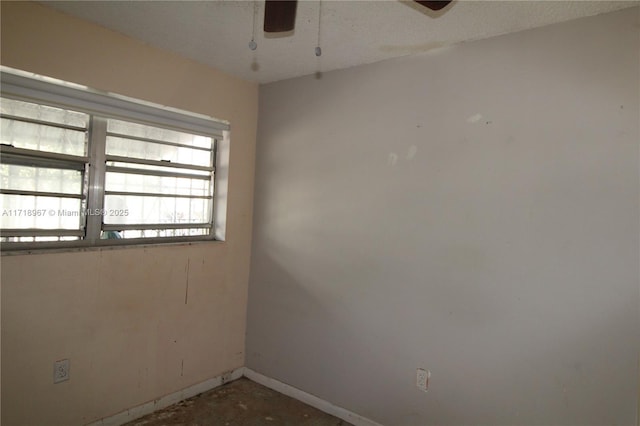 empty room featuring ceiling fan