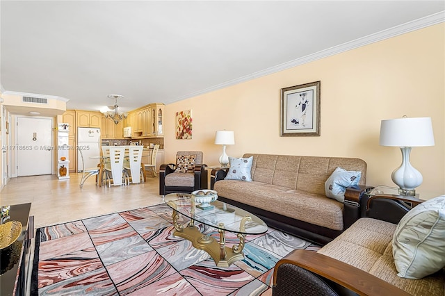 living room featuring ornamental molding and an inviting chandelier