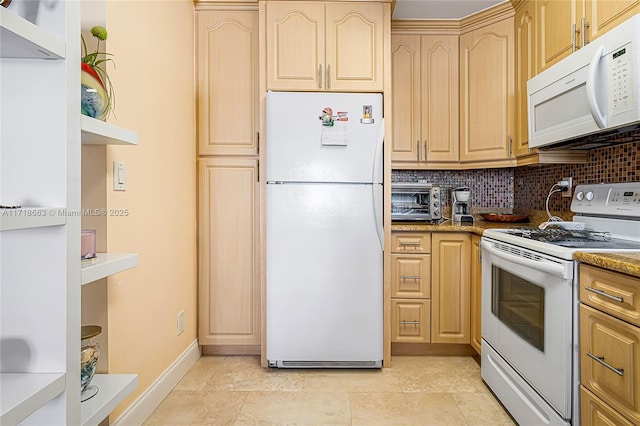 kitchen featuring decorative backsplash, light brown cabinets, light stone countertops, and white appliances