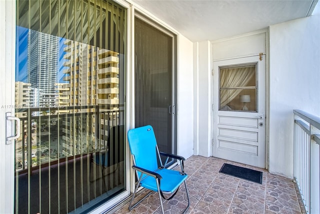 entrance to property featuring a balcony