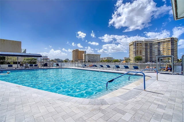 view of swimming pool with a patio area