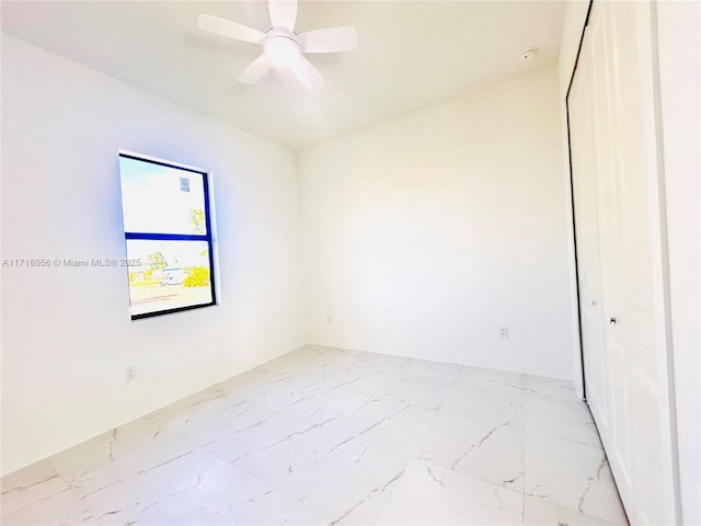 empty room featuring ceiling fan