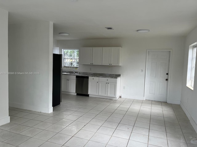 kitchen featuring sink, fridge, dishwasher, and white cabinets