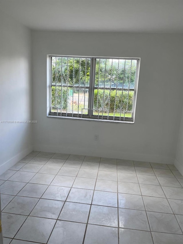 view of tiled spare room