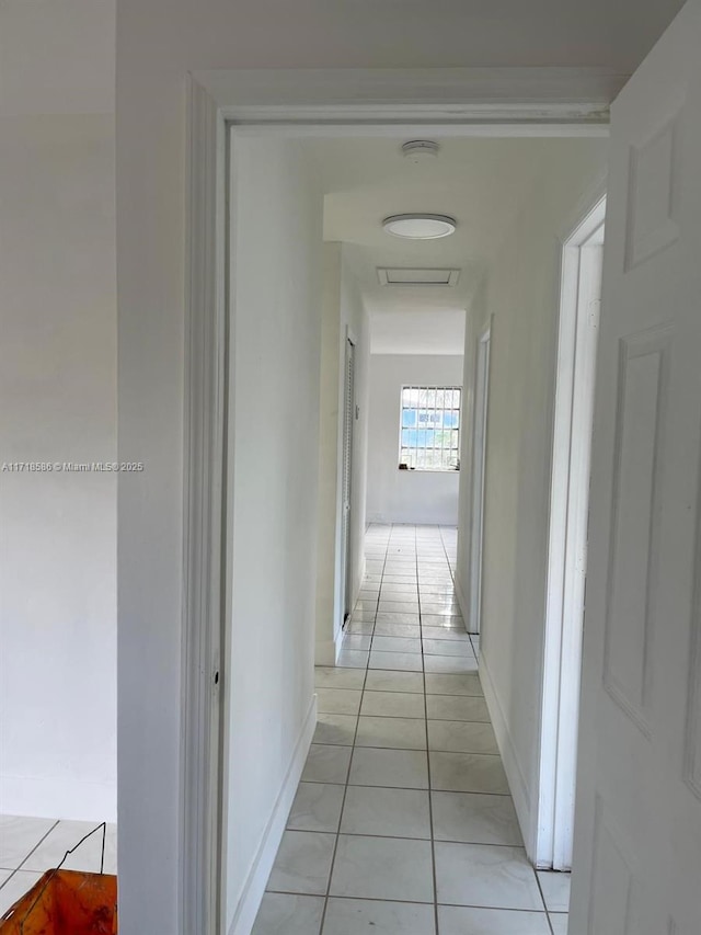 hallway featuring light tile patterned floors