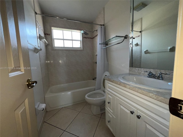 full bathroom with tile patterned flooring, vanity, toilet, and tiled shower / bath