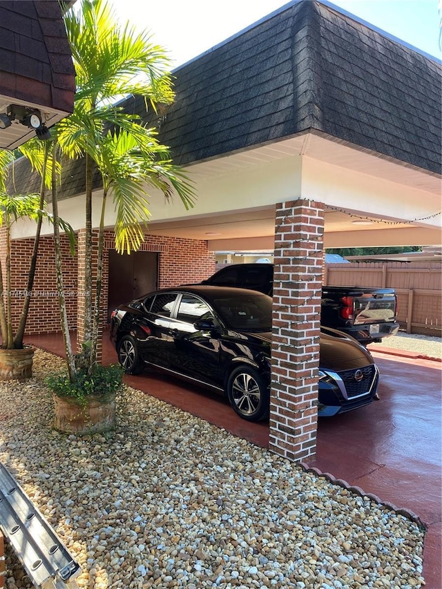 view of parking / parking lot featuring a carport