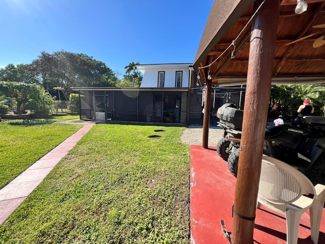 view of yard featuring a sunroom