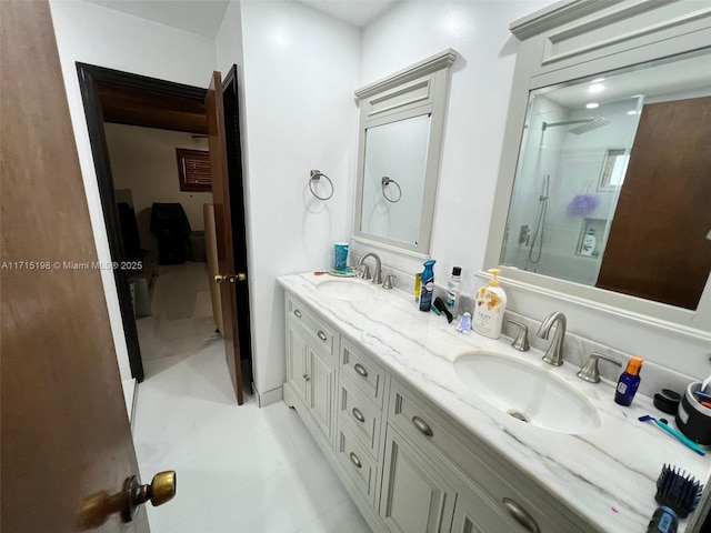 bathroom featuring tile patterned flooring, vanity, and a shower with shower door