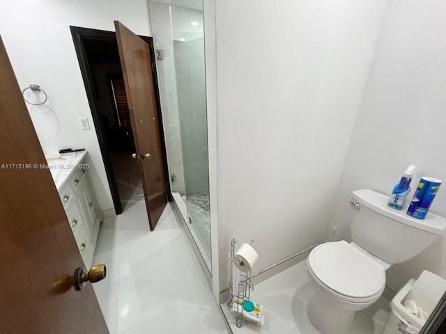 bathroom featuring toilet, vanity, tile patterned floors, and walk in shower