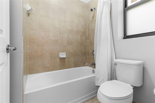 bathroom featuring shower / bath combo and toilet