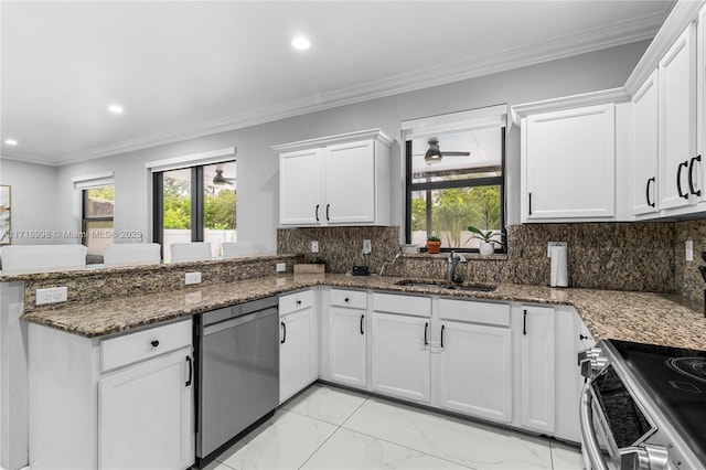 kitchen featuring white cabinets, appliances with stainless steel finishes, backsplash, and dark stone counters