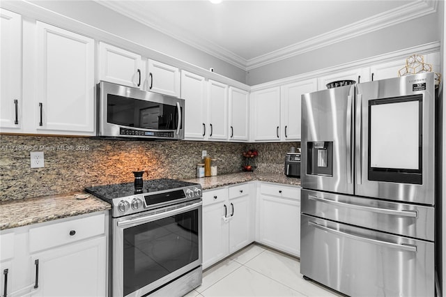 kitchen with stone countertops, white cabinetry, backsplash, and appliances with stainless steel finishes