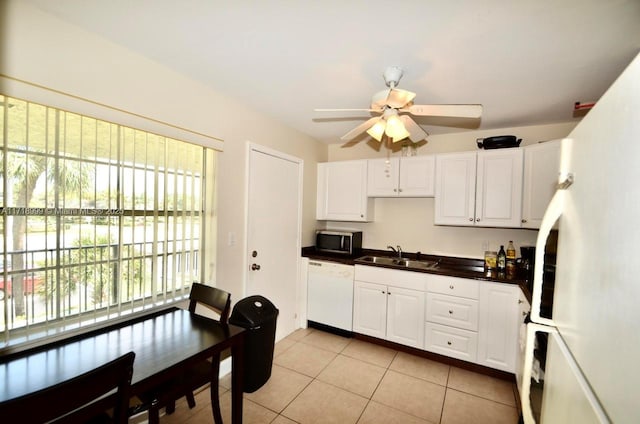 kitchen featuring white cabinetry, sink, ceiling fan, white appliances, and light tile patterned floors