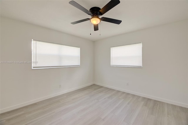 empty room with ceiling fan and light wood-type flooring