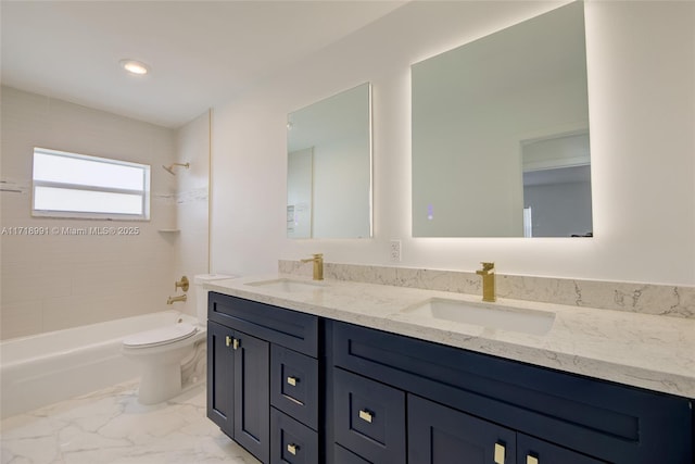 full bathroom featuring tiled shower / bath combo, toilet, and vanity