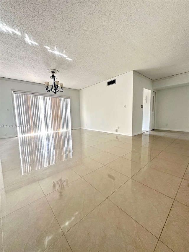 empty room with a notable chandelier