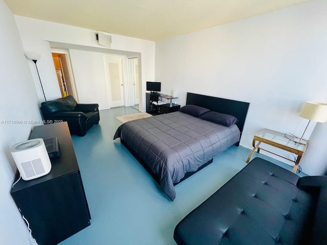 bedroom with concrete floors