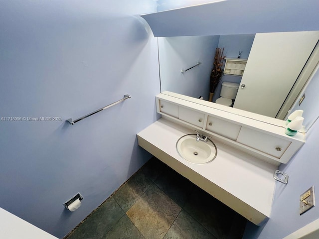 bathroom with toilet and sink