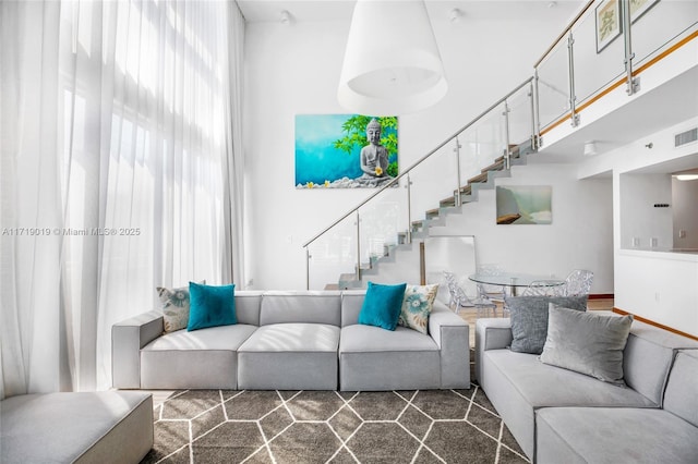 living room with a high ceiling