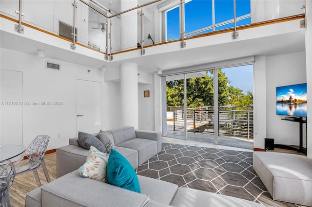 living room featuring a high ceiling