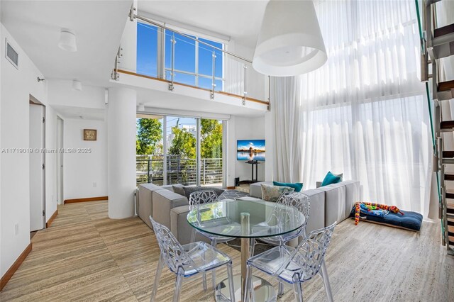 dining space featuring a high ceiling