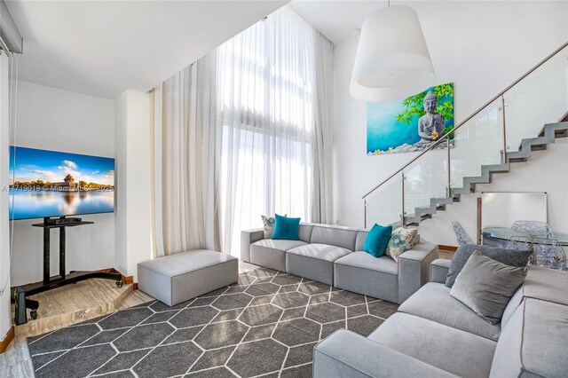 living room featuring a high ceiling