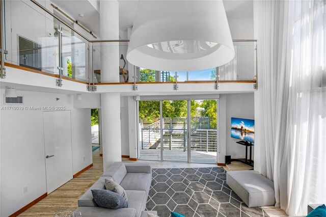 living room with a high ceiling