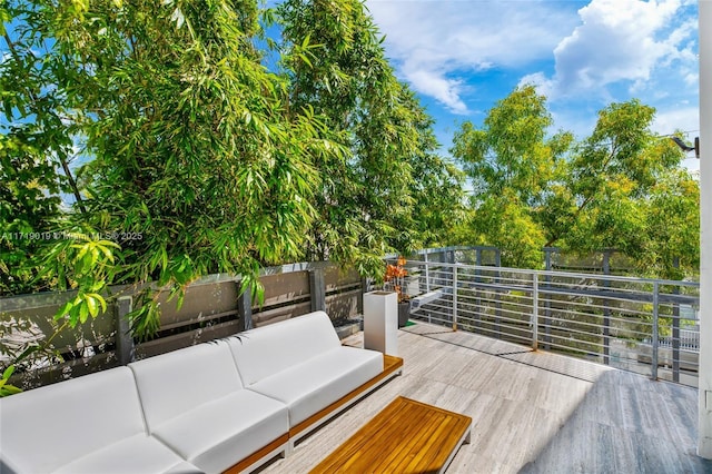 wooden terrace featuring an outdoor hangout area