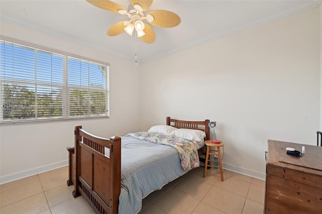 bedroom featuring ceiling fan, ornamental molding, and light tile patterned floors