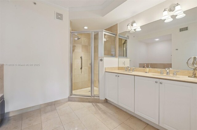 bathroom featuring ornamental molding, vanity, tile patterned floors, and an enclosed shower