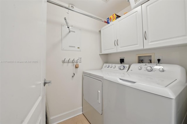 washroom featuring cabinets and independent washer and dryer