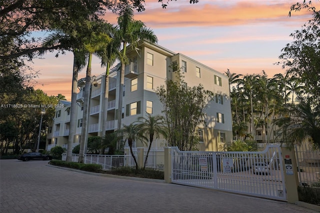 view of outdoor building at dusk