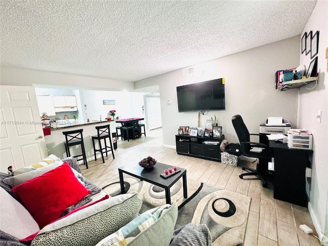 living room featuring a textured ceiling