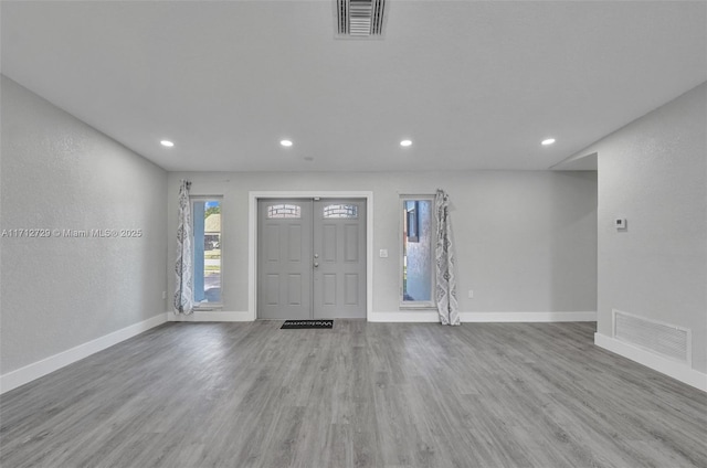 entrance foyer featuring light hardwood / wood-style floors