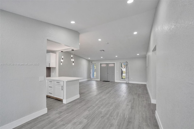 unfurnished living room with light wood-type flooring