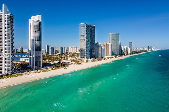 aerial view featuring a view of the beach and a water view