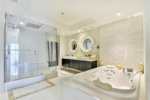 bathroom featuring a raised ceiling, plus walk in shower, tile patterned flooring, and vanity