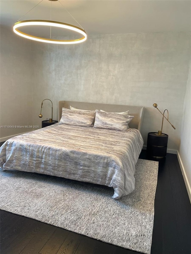 bedroom featuring wood-type flooring